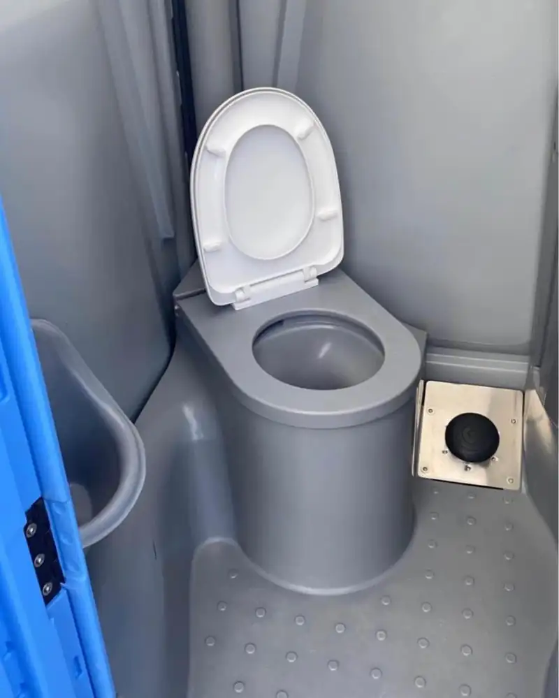 Flushing porta potty interior with mirror and soap at an event in Midland, TX