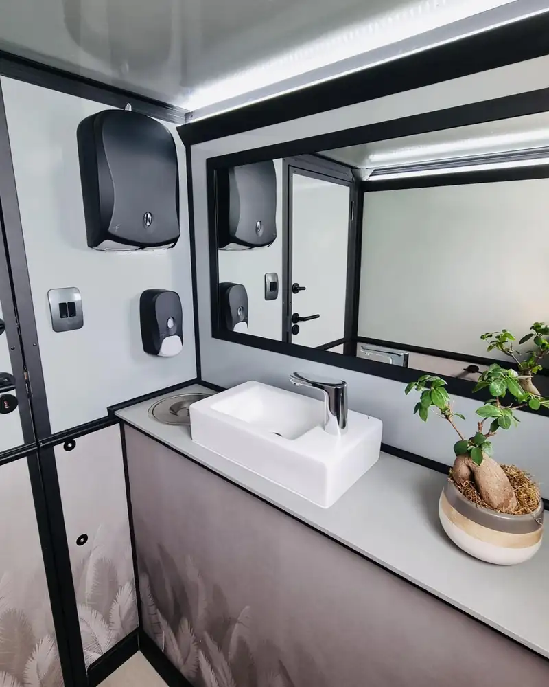 Restroom trailer vanity sink with running water in Midland, TX